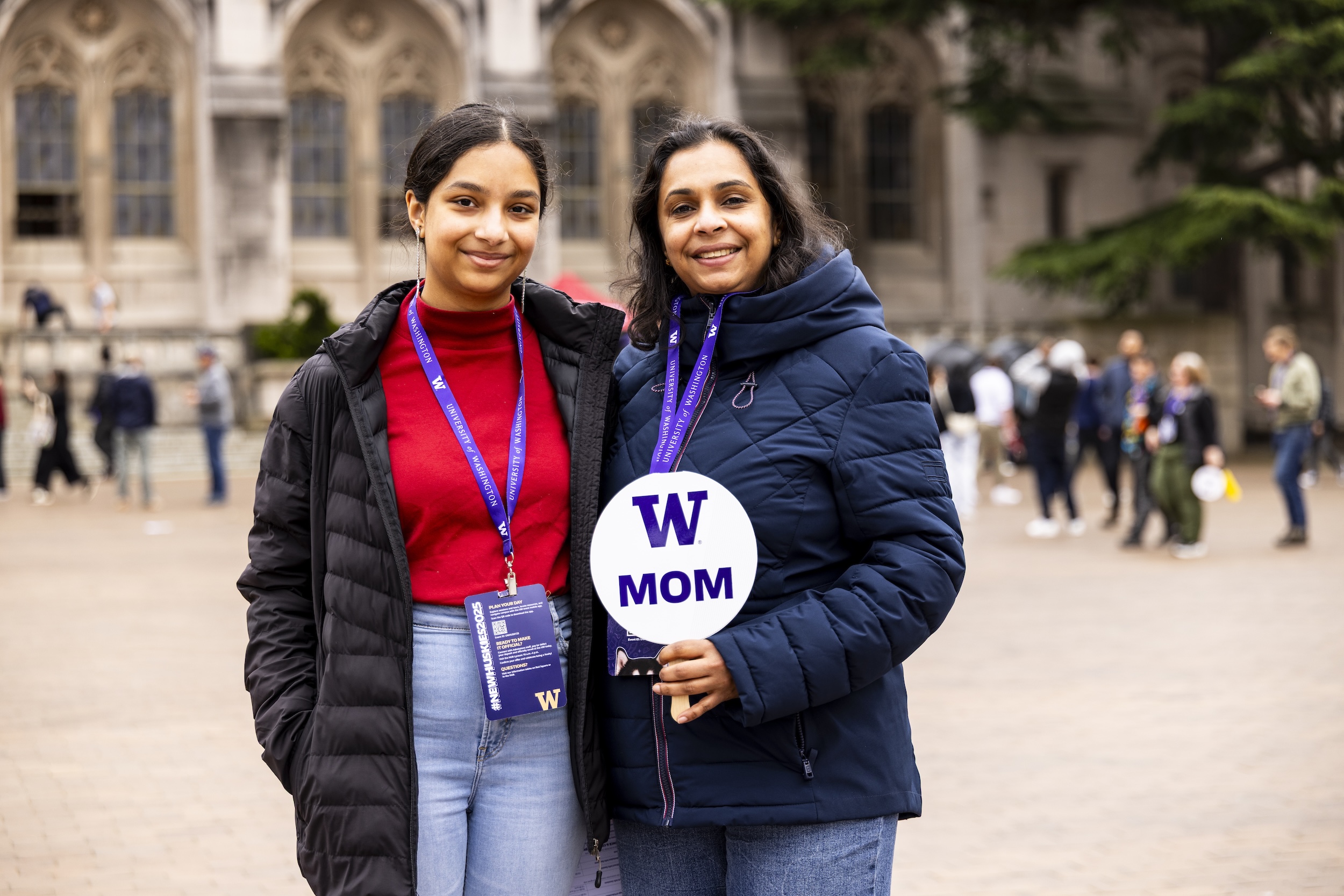 Student and her mom standing in red square