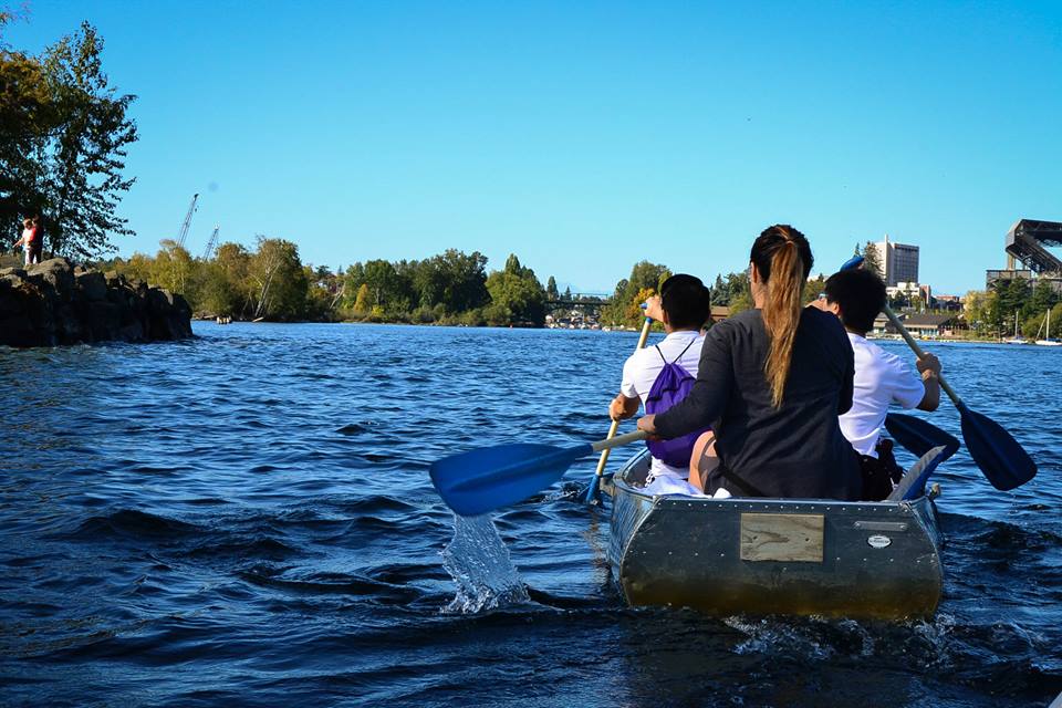 Students in canoes in Lake WA