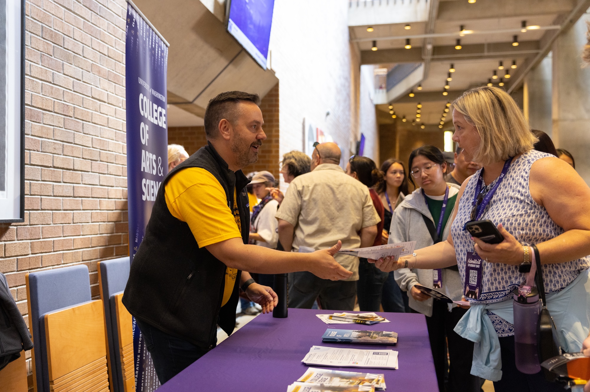 Staff greeting families at UW Admitted Student Preview Day