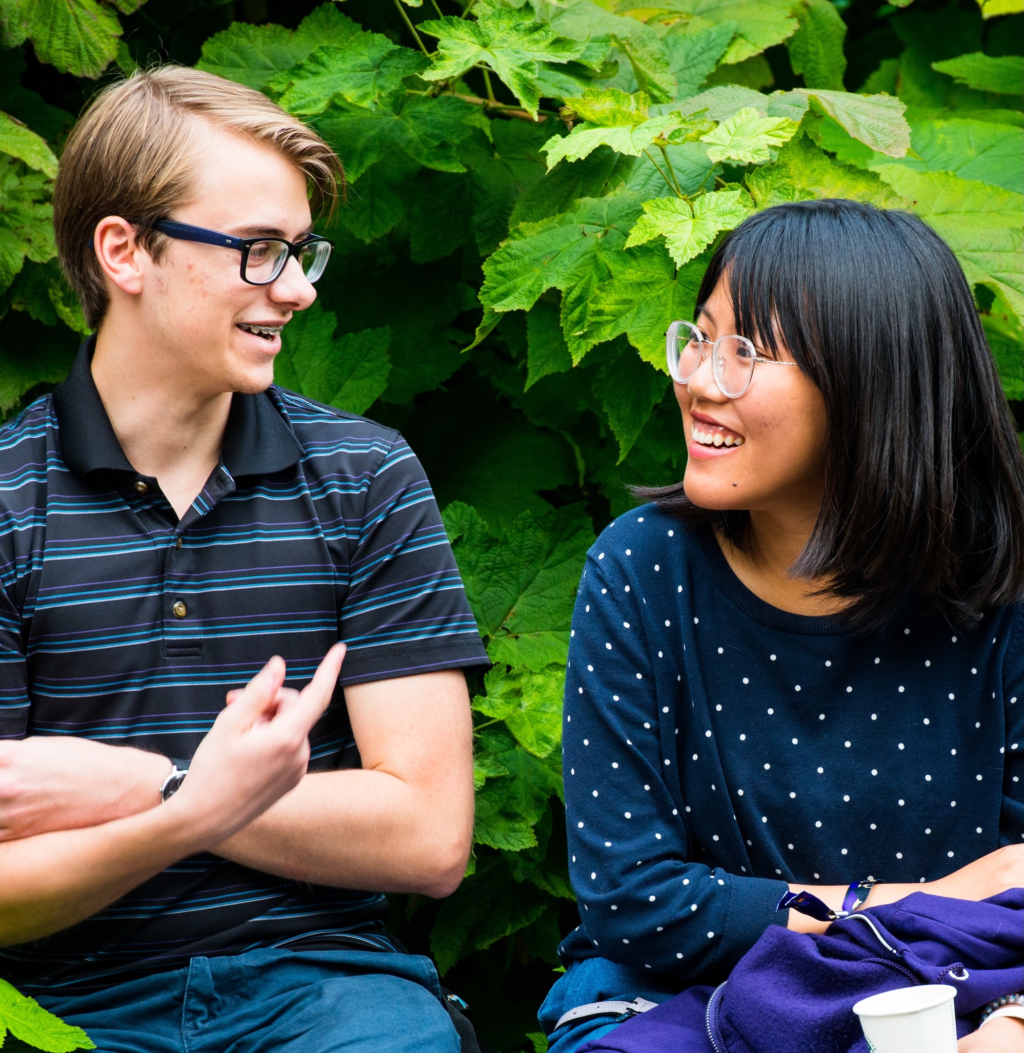 Two students looking at each other and chatting 