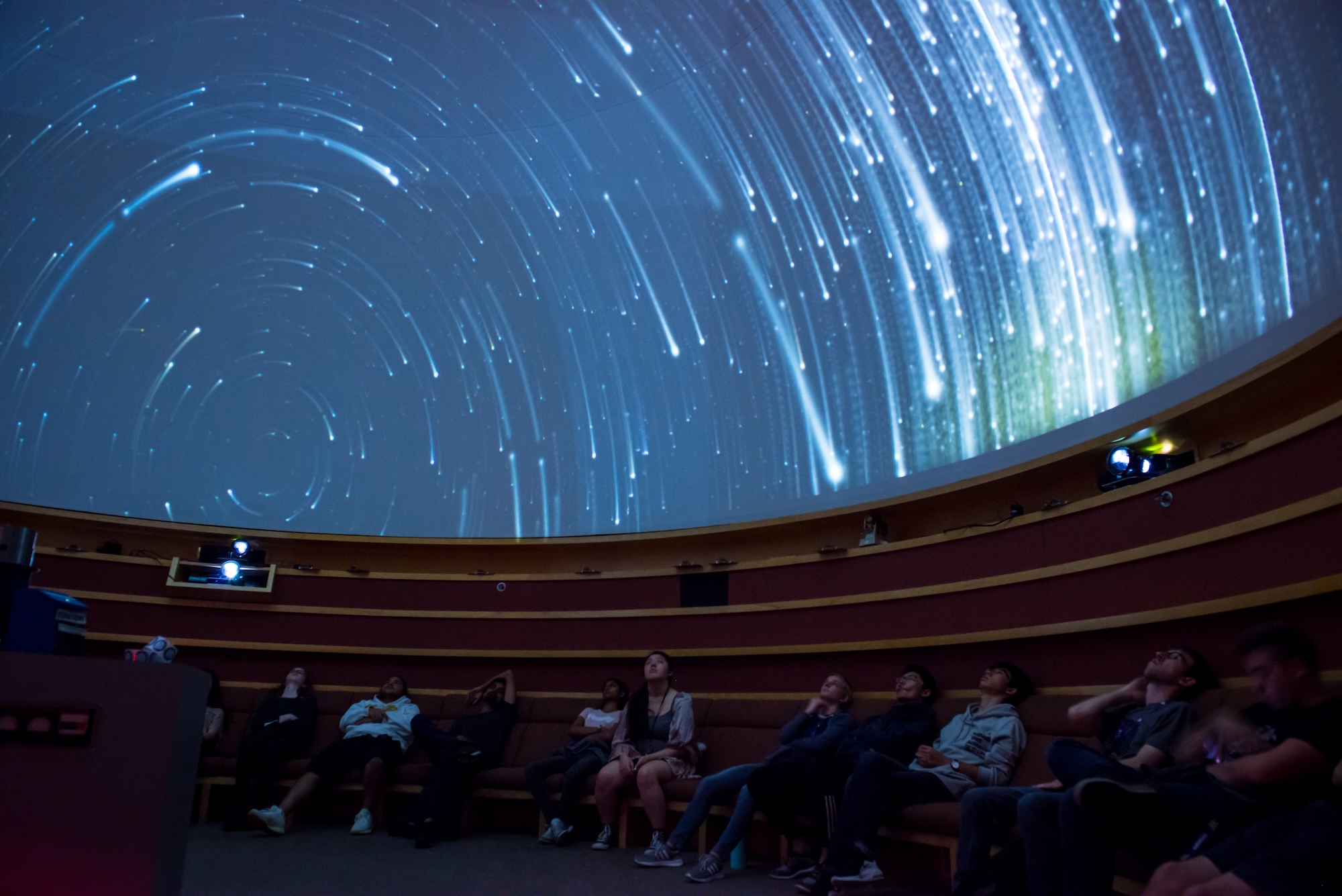 Students laying down in the Planetarium 