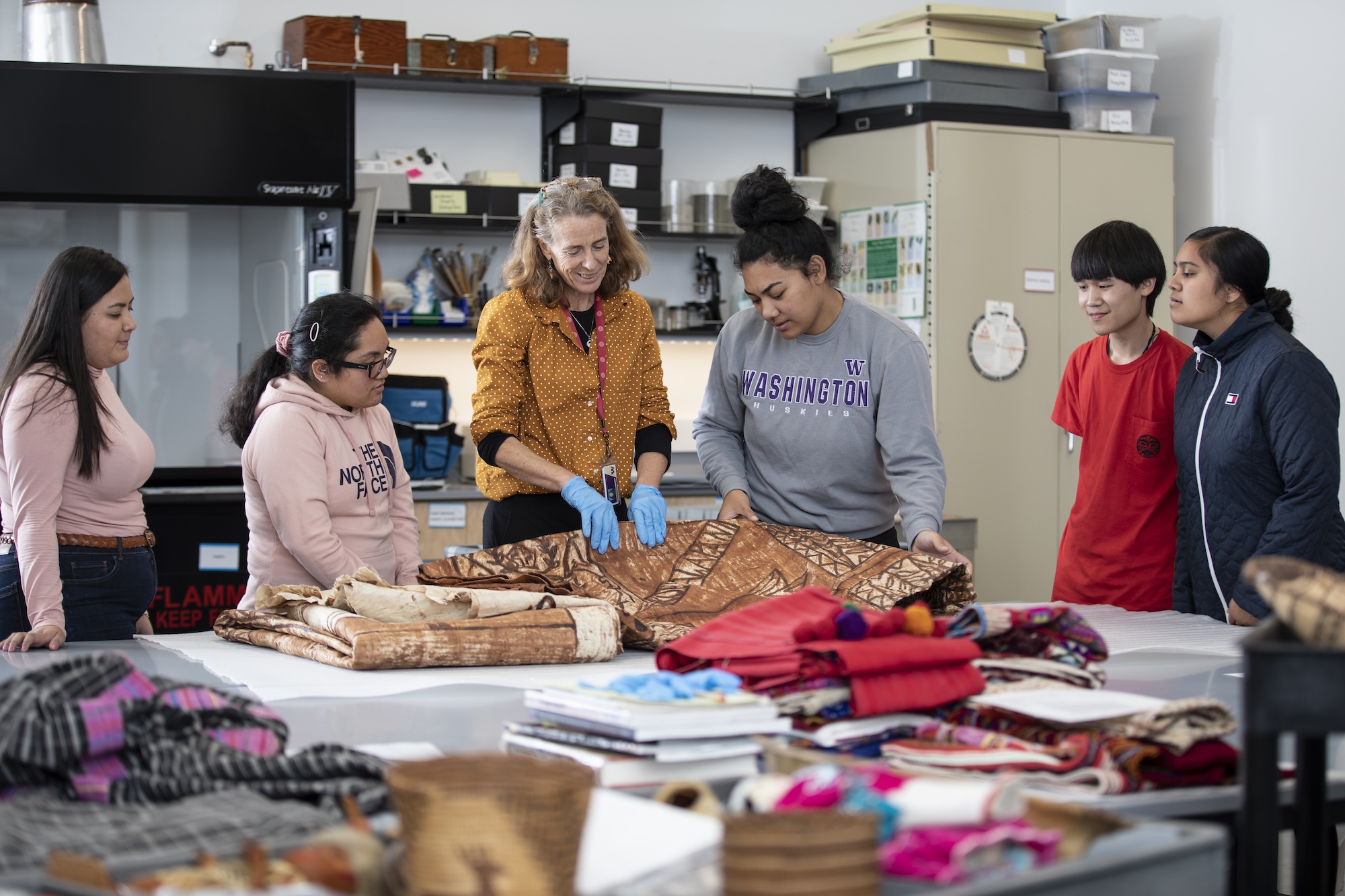 Students meeting with Holly Barker inside the Burke Museum
