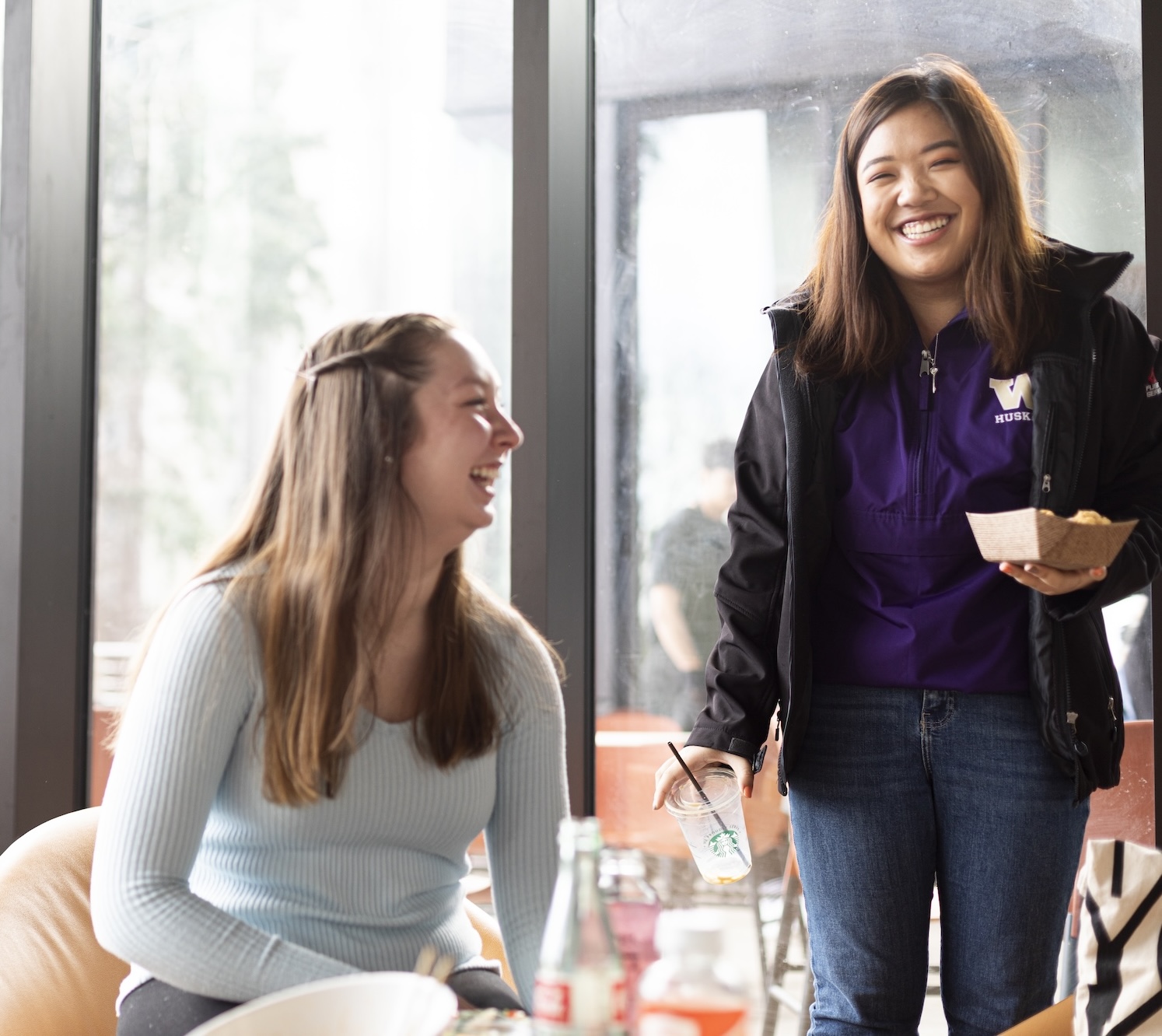 Two students chatting in a UW residential hall