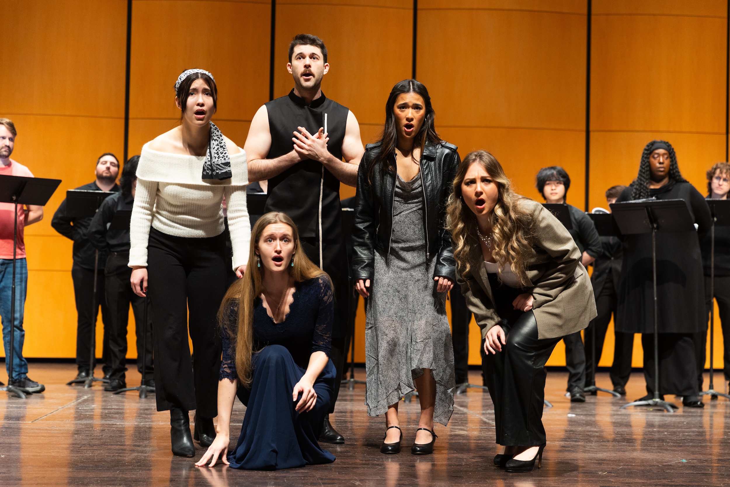 Students singing in an opera performance.